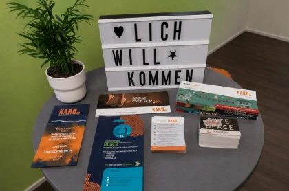 Cards and flyers are laid out on a table